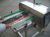 Textile industy. TUNN-AL metal detector for checks on neck ties. Research of clippers, needeles, copper wires